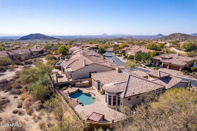 drone / aerial view with a residential view and a mountain view