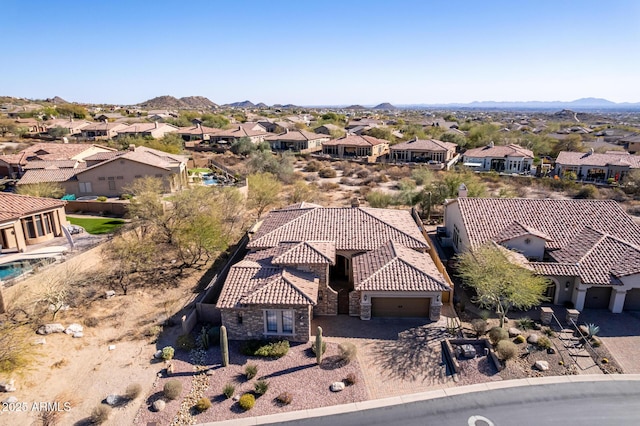 birds eye view of property featuring a mountain view and a residential view