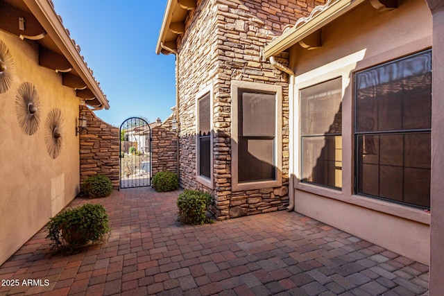 view of patio / terrace with a gate