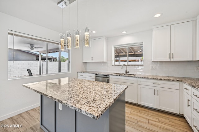 1017 S Allen, Mesa, AZ 85204 - kitchen with stainless steel dishwasher, light wood finished floors, plenty of natural light, and recessed lighting