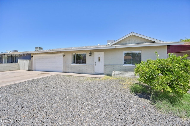 1017 S Allen, Mesa, AZ 85204 - ranch-style house featuring brick siding, an attached garage, and driveway