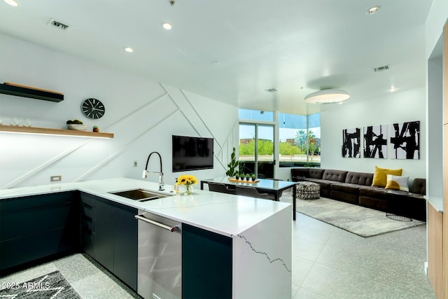 kitchen with light stone counters, sink, kitchen peninsula, and dishwasher