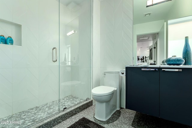 bathroom featuring walk in shower, toilet, and tile walls