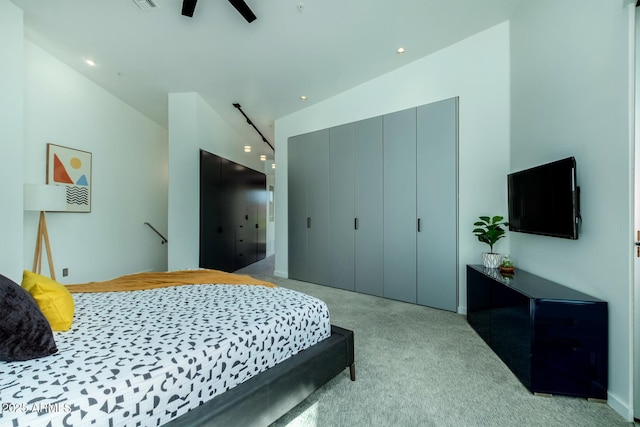 bedroom with light colored carpet and ceiling fan