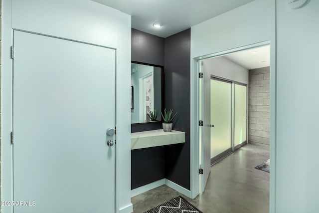 bathroom with concrete flooring