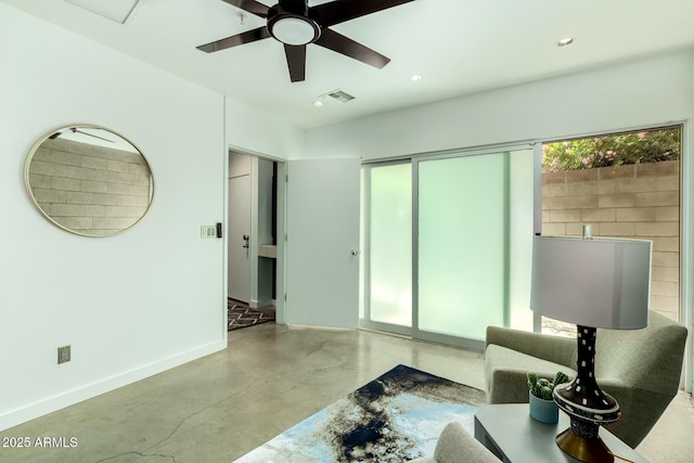 interior space with ceiling fan