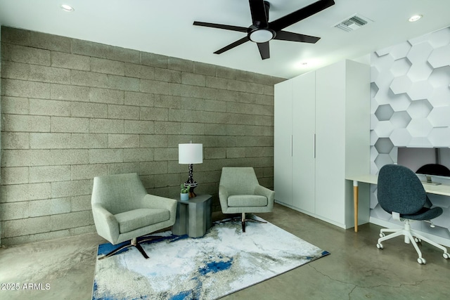 living area featuring concrete floors