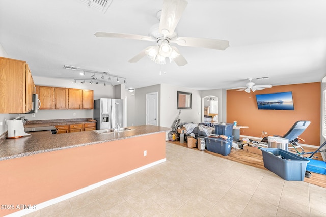 kitchen with ceiling fan, appliances with stainless steel finishes, and sink