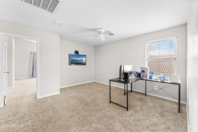 office area featuring ceiling fan and light colored carpet