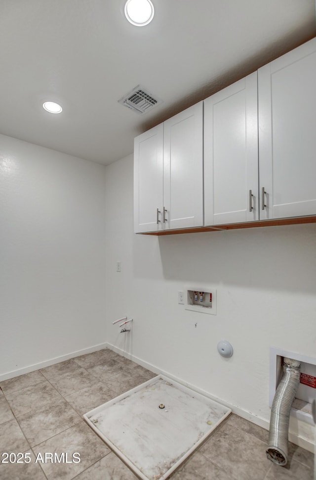 clothes washing area featuring hookup for a washing machine, hookup for a gas dryer, and cabinets