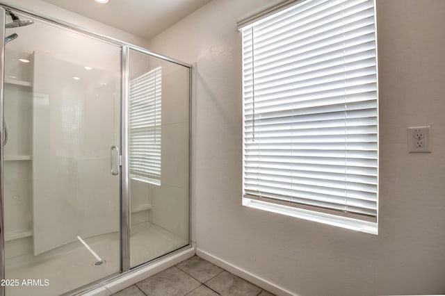 bathroom featuring tile patterned flooring and walk in shower