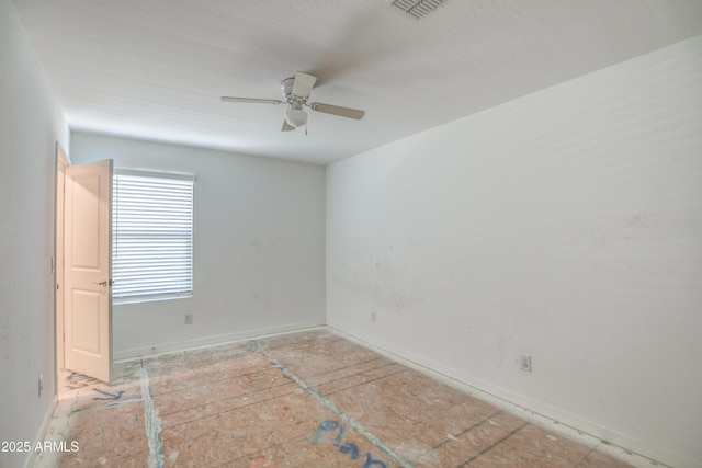 empty room featuring ceiling fan