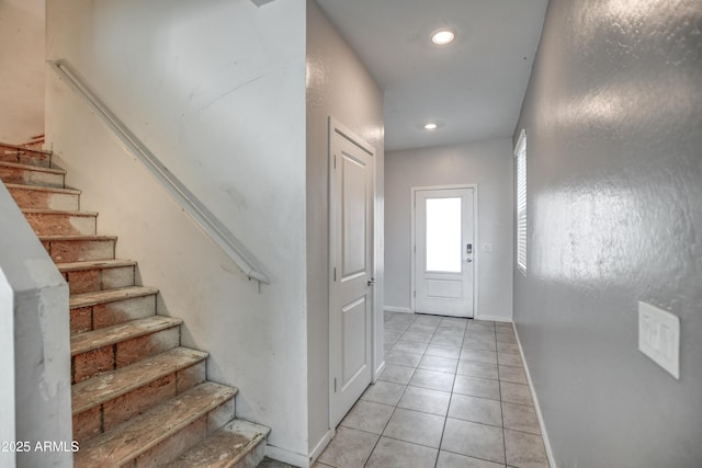 entryway with light tile patterned floors