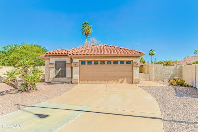1048 N Arroya, Mesa, AZ 85205 - mediterranean / spanish house with a tile roof, driveway, an attached garage, a gate, and stucco siding