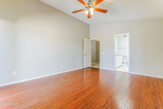 1048 N Arroya, Mesa, AZ 85205 - empty room with a ceiling fan, light wood-style flooring, and high vaulted ceiling