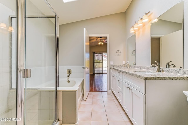 1048 N Arroya, Mesa, AZ 85205 - full bathroom with a ceiling fan, a garden tub, double vanity, tile patterned floors, and a stall shower