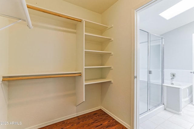 1048 N Arroya, Mesa, AZ 85205 - spacious closet featuring wood finished floors