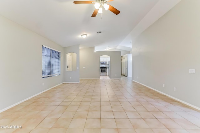 1048 N Arroya, Mesa, AZ 85205 - unfurnished living room with arched walkways, ceiling fan, vaulted ceiling, and light tile patterned floors