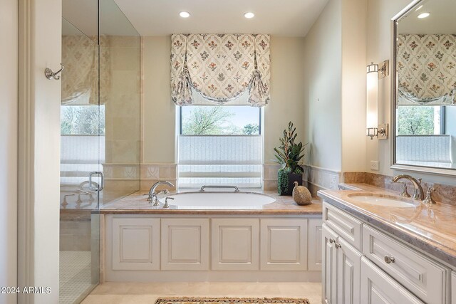 bathroom featuring vanity, separate shower and tub, and tile patterned flooring