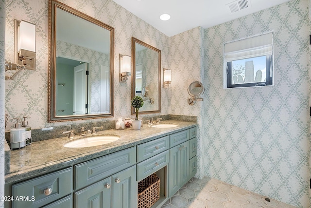 bathroom with tile patterned floors and vanity