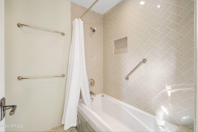 bathroom featuring shower / bath combination with curtain