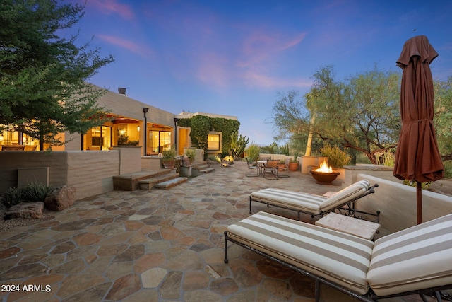 view of patio terrace at dusk