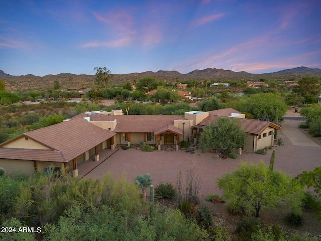 aerial view at dusk with a mountain view