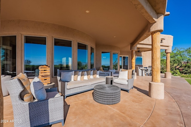 view of patio / terrace with an outdoor living space and ceiling fan