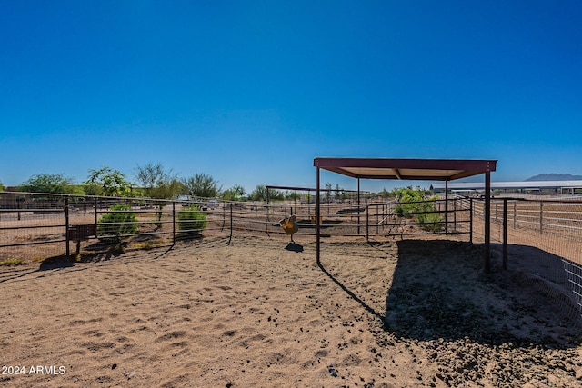 exterior space with an outbuilding and a rural view