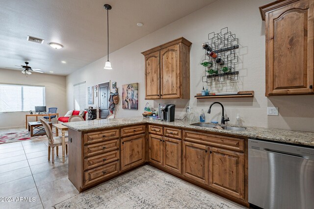 kitchen featuring sink, kitchen peninsula, hanging light fixtures, ceiling fan, and stainless steel dishwasher