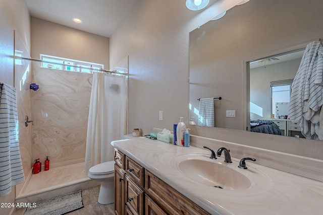 bathroom featuring vanity, toilet, tile patterned floors, and a shower with curtain