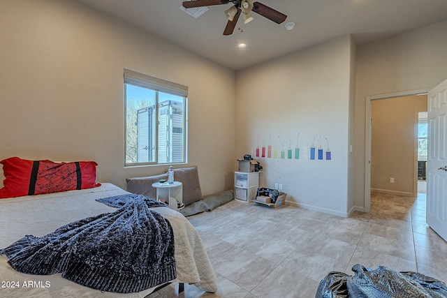 bedroom featuring light tile patterned floors and ceiling fan