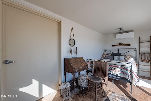 bedroom featuring an AC wall unit