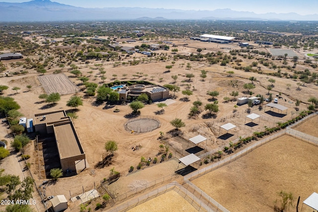 birds eye view of property featuring a mountain view