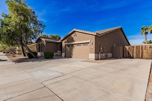 view of side of home with a garage