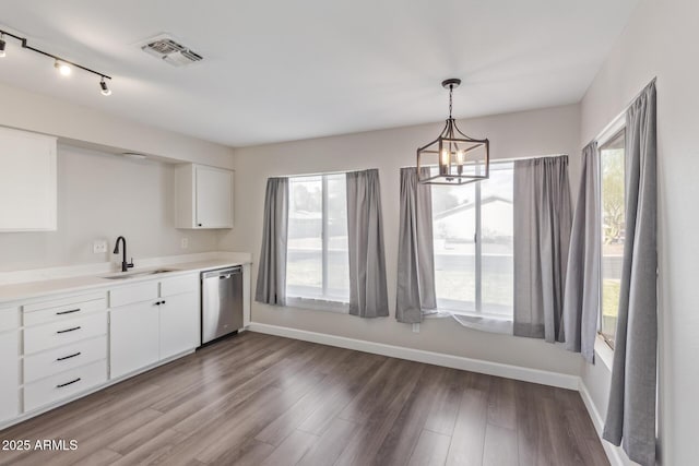 11671 S Jokake St, Phoenix, AZ 85044 - kitchen with a sink, stainless steel dishwasher, white cabinetry, wood finished floors, and plenty of natural light
