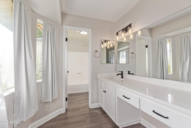 11671 S Jokake St, Phoenix, AZ 85044 - full bathroom featuring vanity, baseboards, and wood finished floors