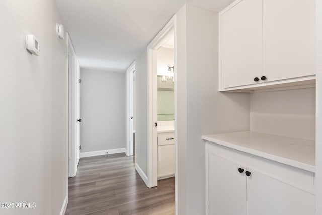 11671 S Jokake St, Phoenix, AZ 85044 - hall featuring dark wood finished floors and baseboards