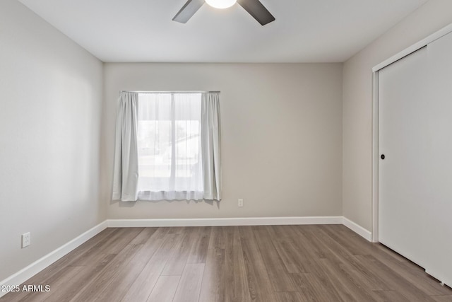 11671 S Jokake St, Phoenix, AZ 85044 - unfurnished room featuring ceiling fan, wood finished floors, and baseboards