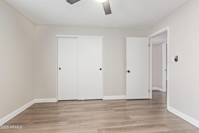 11671 S Jokake St, Phoenix, AZ 85044 - unfurnished bedroom with a closet, baseboards, light wood-style floors, and a ceiling fan