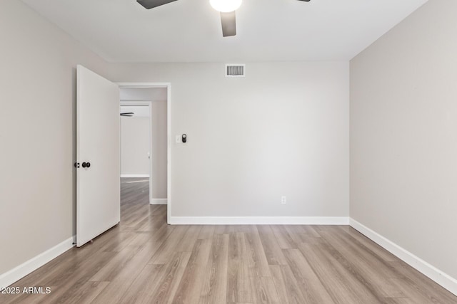 11671 S Jokake St, Phoenix, AZ 85044 - spare room with a ceiling fan, light wood-style floors, and baseboards
