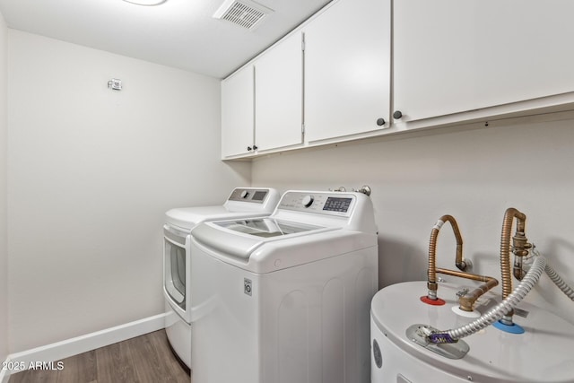 11671 S Jokake St, Phoenix, AZ 85044 - laundry room with cabinet space, washing machine and clothes dryer, wood finished floors, baseboards, and water heater
