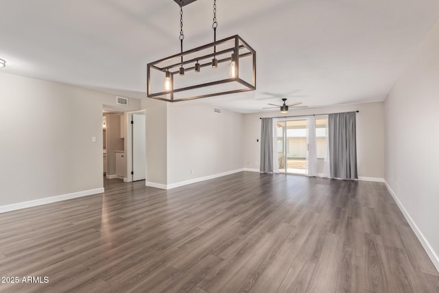 11671 S Jokake St, Phoenix, AZ 85044 - unfurnished living room with a ceiling fan, wood finished floors, and baseboards