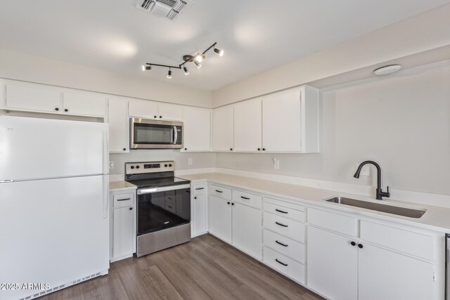 11671 S Jokake St, Phoenix, AZ 85044 - kitchen with stainless steel appliances, a sink, and white cabinets