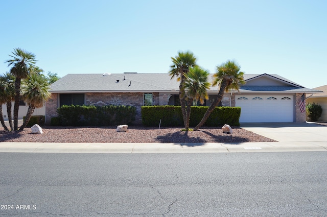 single story home featuring a garage