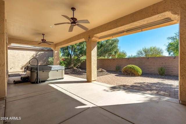 view of patio with a hot tub and ceiling fan