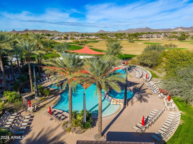 view of pool featuring a patio area and a mountain view