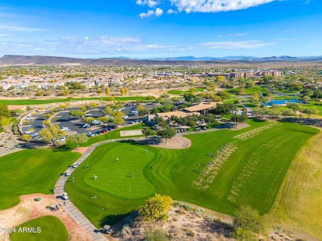 birds eye view of property with a mountain view