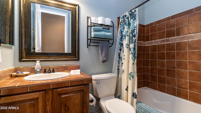 full bathroom with shower / bath combo, vanity, and toilet