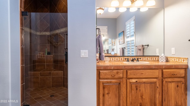 bathroom featuring walk in shower and vanity